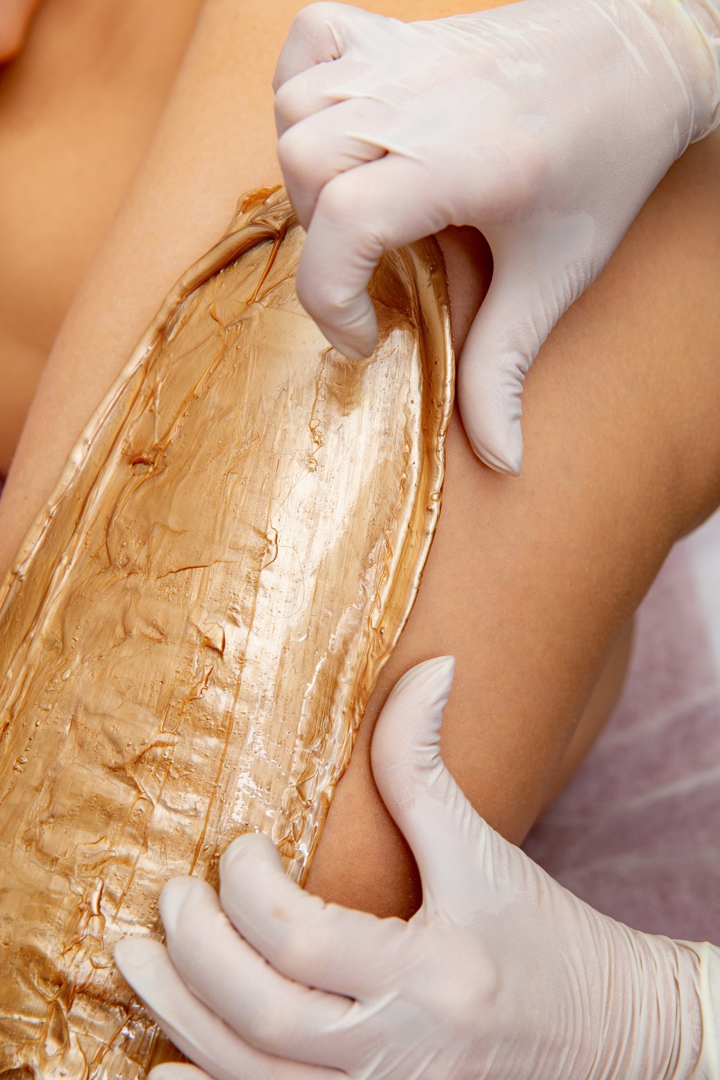 Woman Getting Body Wax at Beautician - stock photo